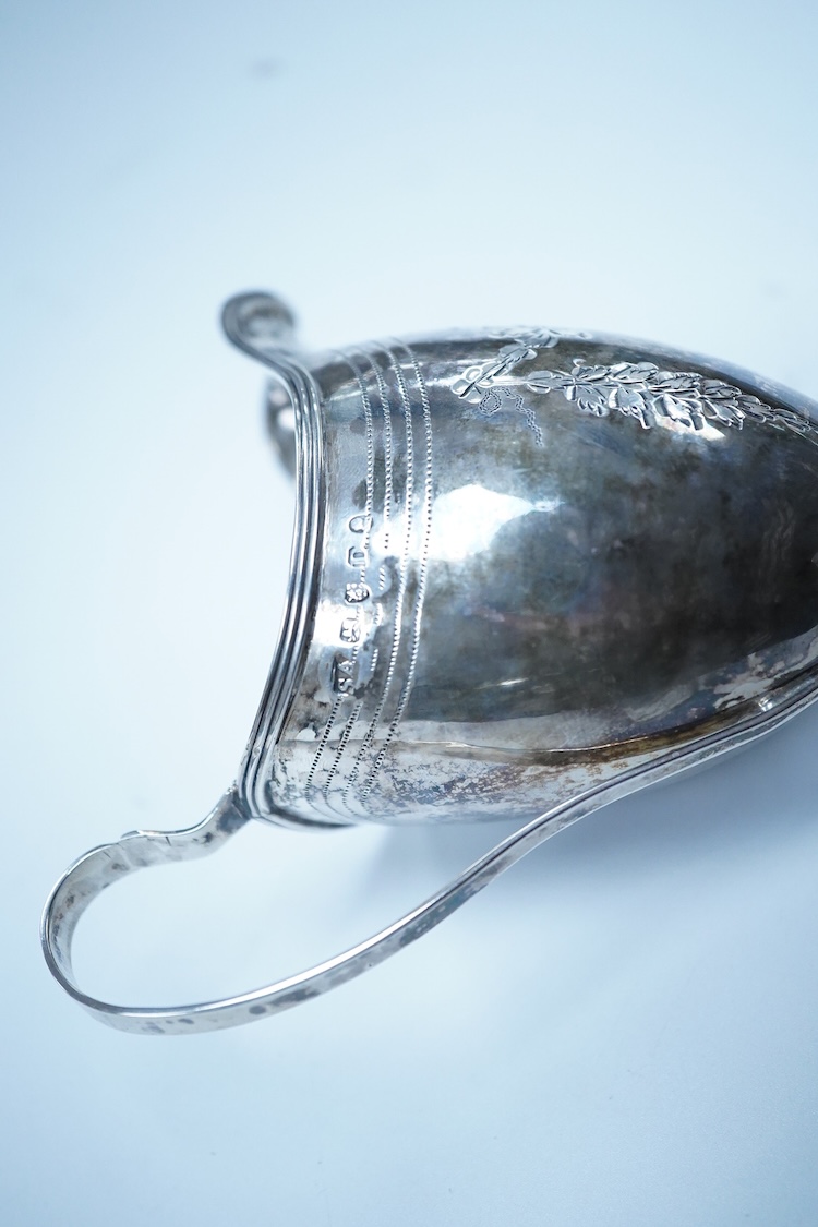 A George III silver helmet shaped cream jug, by Stephen Adams II, London, 1799, 12.8cm, 87 grams.